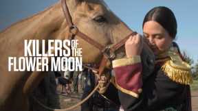 Killers of the Blossom Moon-- Lily Gladstone Feeds a Steed On Set